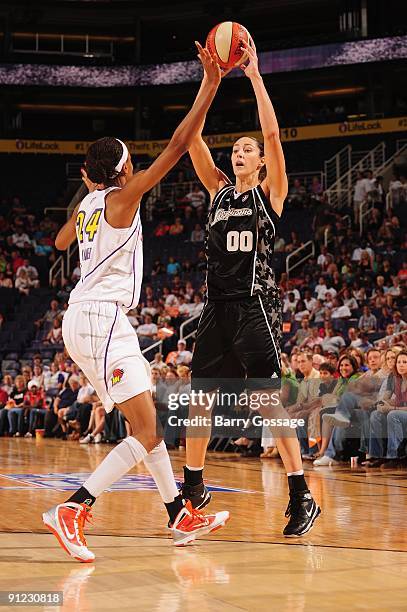 Ruth Riley of the San Antonio Silver Stars looks to move the ball against DeWanna Bonner of the Phoenix Mercury in Game Two of the WNBA Western...