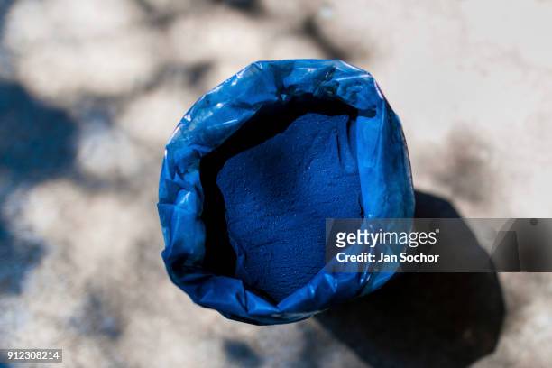 Natural indigo powder, packed in a plastic bag, is seen at the semi-industrial manufacture near San Miguel, El Salvador on November 12, 2016. For...