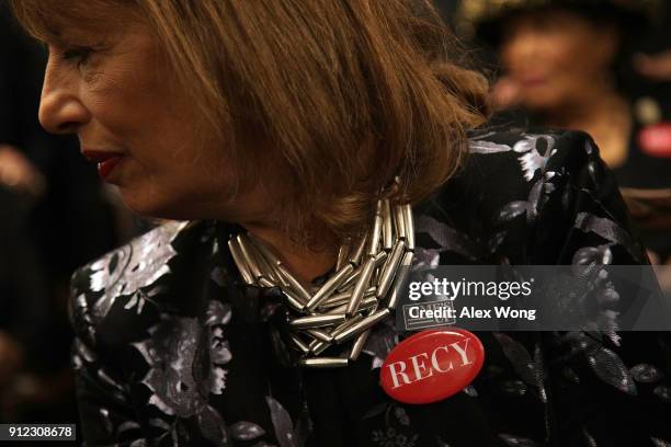 Rep. Jackie Speier wears black with a "Time's Up" pin and a "RECY" button as she participates in a photo-op at the U.S. Capitol prior to President...