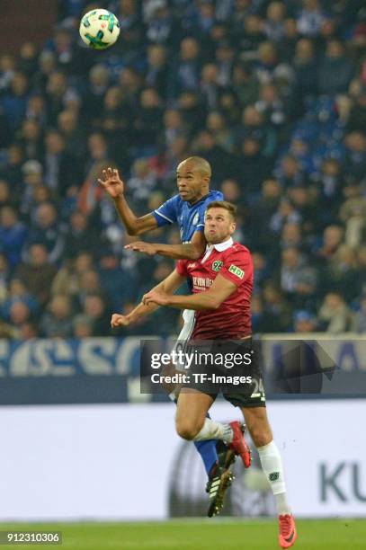 Naldo of Schalke and Niclas Fuellkrug of Hannover battle for the ball during the Bundesliga match between FC Schalke 04 and Hannover 96 at...