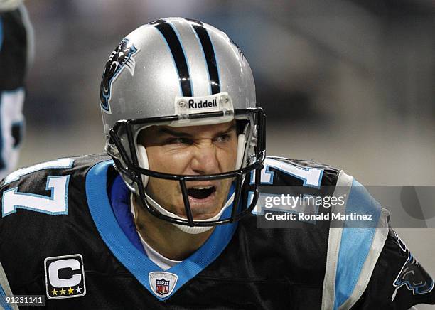 Jake Delhomme of the Carolina Panthers reacts after throwing for a touchdown in the second quarter against the Dallas Cowboys at Cowboys Stadium on...