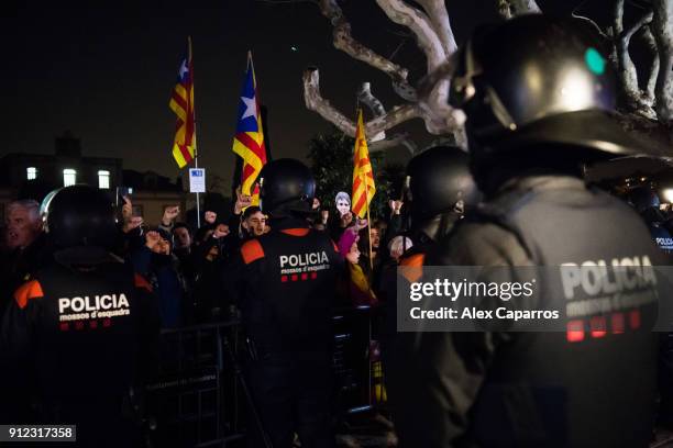 Demonstrators take part in a protest to support former Catalan President, Carles Puigdemont in front of the Parliament of Catalonia on January 30,...