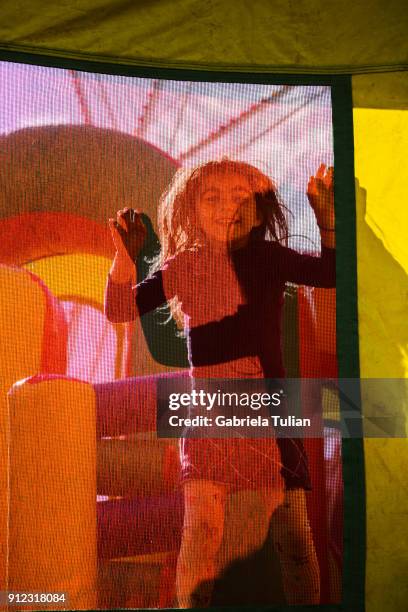 happy smiling children playing on an inflatable bounce house - bounce castle stock pictures, royalty-free photos & images