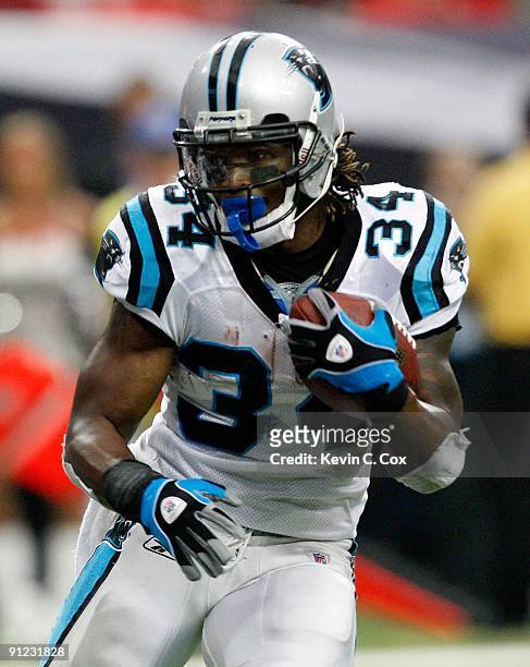 DeAngelo Williams of the Carolina Panthers is slow to get up against the Atlanta Falcons at Georgia Dome on September 20, 2009 in Atlanta, Georgia.