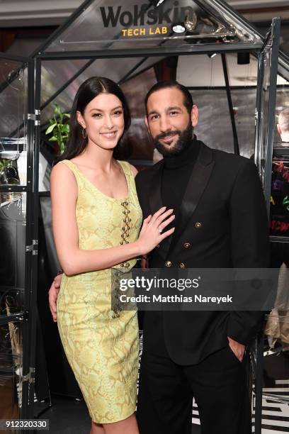 Rebecca Mir and Massimo Sinato attend the Wolfskin Tech Lab x Gianni Versace retrospective opening event at Kronprinzenpalais on January 30, 2018 in...