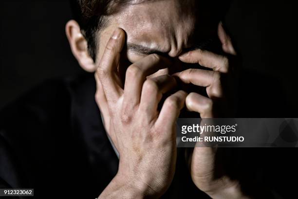stressed male lawyer - touching head stock pictures, royalty-free photos & images
