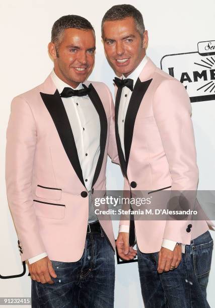 Dean and Dan Caten attend amfAR Milano 2009 red carpet, the Inaugural Milan Fashion Week event at La Permanente on September 28, 2009 in Milan, Italy.