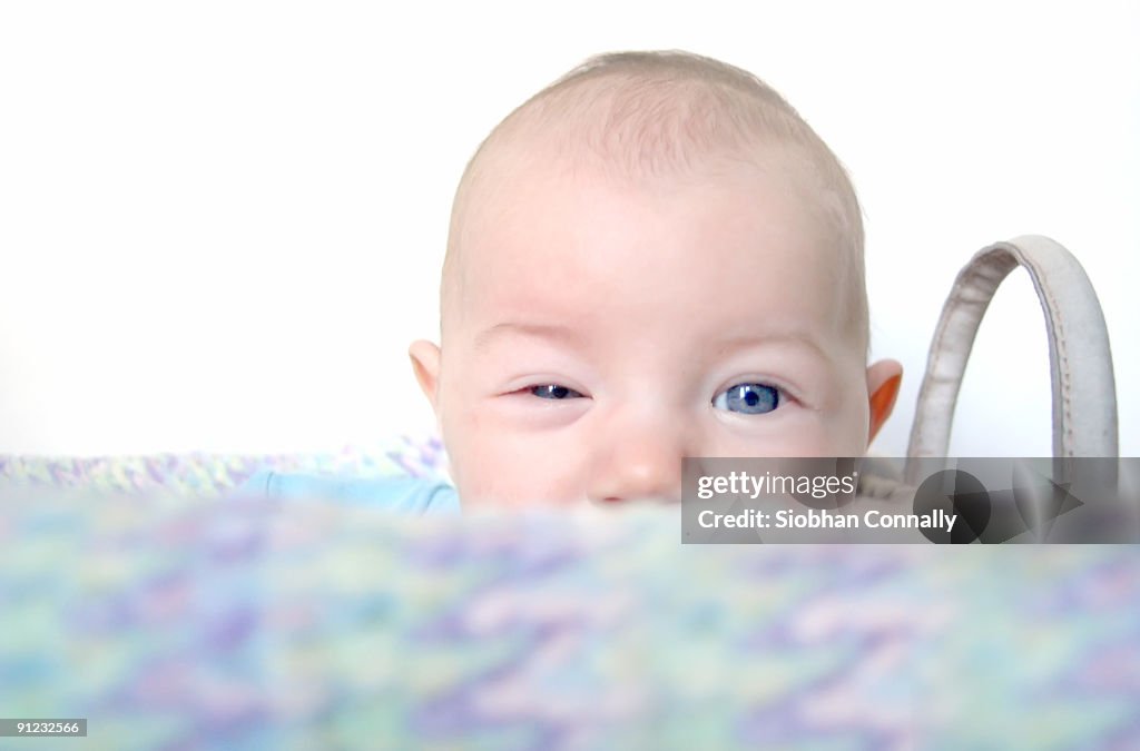 Blue eyes - baby winking, portrait 