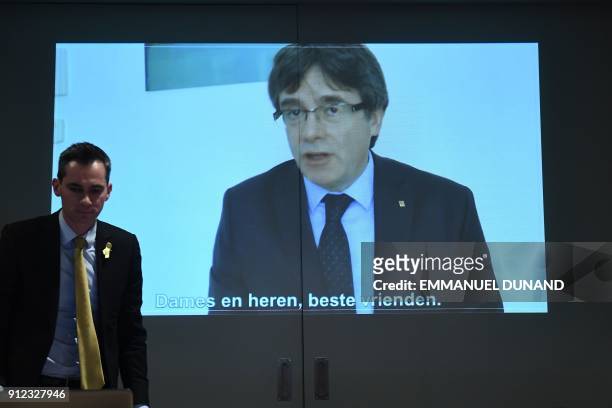 Picture shows a screen displaying a live broadcast of a speech by ousted Catalan separatist leader Carles Puigdemont at the New Year reception of the...