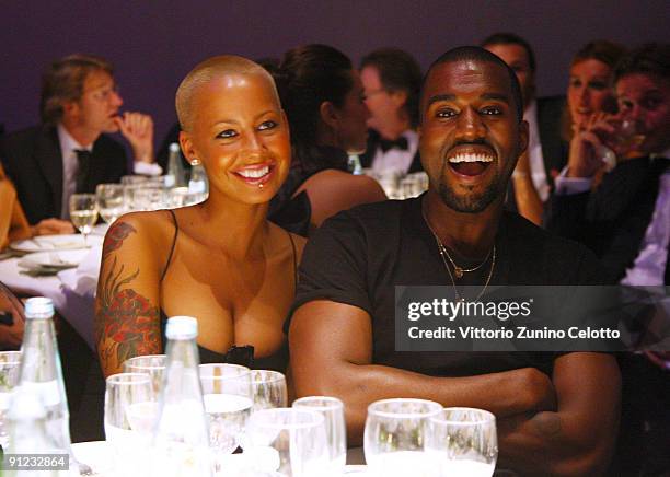 Amber Rose and Kanye West attend amfAR Milano 2009 Dinner, the Inaugural Milan Fashion Week event at La Permanente on September 28, 2009 in Milan,...