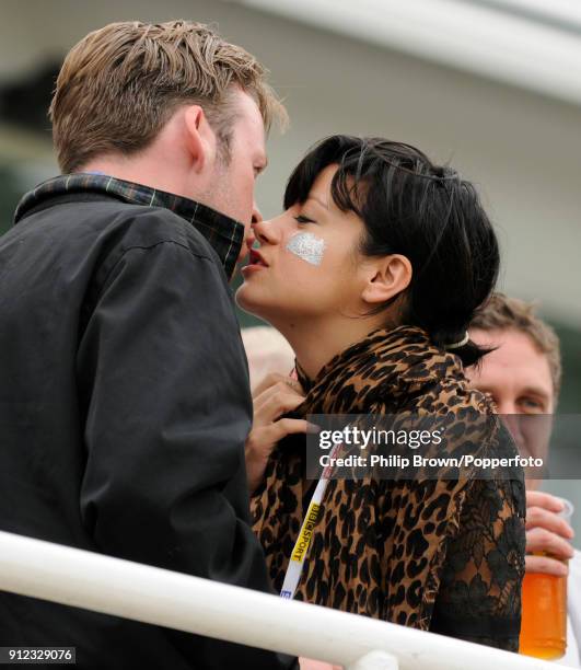 Singer Lily Allen kisses her partner Sam Cooper in the Bedser Stand during the lunch interval on day one of the 5th Test match between England and...