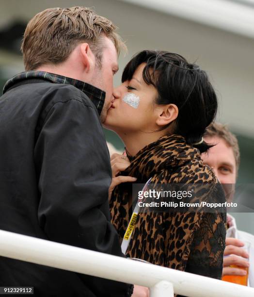 Singer Lily Allen kisses her partner Sam Cooper in the Bedser Stand during the lunch interval on day one of the 5th Test match between England and...