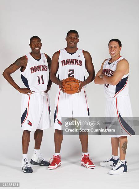 Jamal Crawford, Joe Johnson, and Mike Bibby of the Atlanta Hawks pose during 2009 NBA Media Day on September 28, 2009 at Philips Arena in Atlanta,...