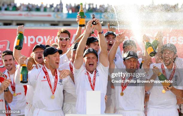 England captain Andrew Strauss lifts the Ashes urn as his team celebrate winning the Ashes after England won the 5th Test match between England and...