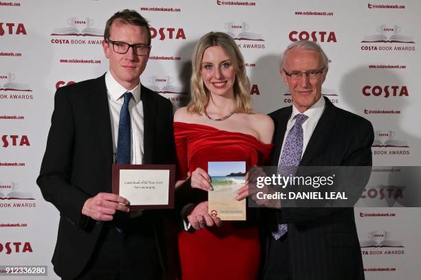 Patrick Charnley, Tess Charnley, and Frank Charnley children and husband of the late British poet and author Helen Dunmore pose with Helen's 'Poetry'...