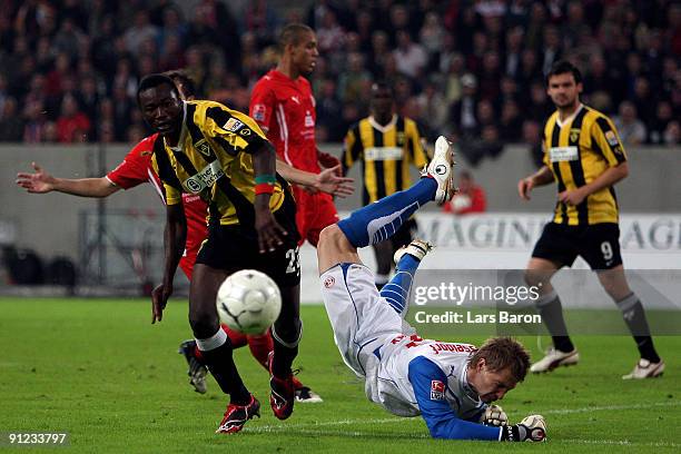 Herve Oussale of Aachen challenges goalkeeper Michael Ratajczak of Duesseldorf during the 2nd Bundesliga match between Fortuna Duesseldorf and...