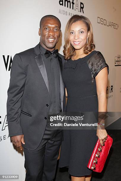 Clarence Seedorf and wife Luviana attend amfAR Milano 2009 Red Carpet, the Inaugural Milan Fashion Week event at La Permanente on September 28, 2009...