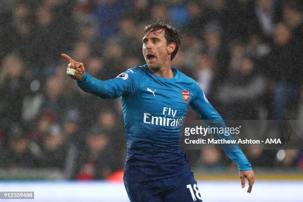 Nacho Monreal of Arsenal celebrates scoring a goal to make the score 0-1 during the Premier League match between Swansea City and Arsenal at Liberty...