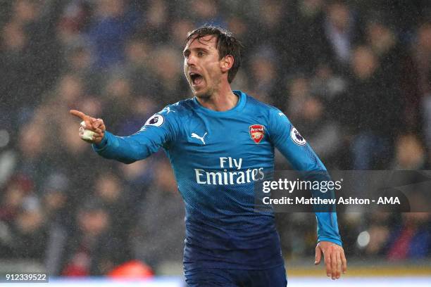 Nacho Monreal of Arsenal celebrates scoring a goal to make the score 0-1 during the Premier League match between Swansea City and Arsenal at Liberty...