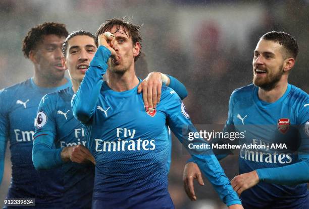 Nacho Monreal of Arsenal celebrates scoring a goal to make the score 0-1 during the Premier League match between Swansea City and Arsenal at Liberty...