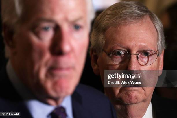 Senate Majority Leader Sen. Mitch McConnell and Senate Majority Whip Sen. John Cornyn listen during a news briefing after the weekly Senate...