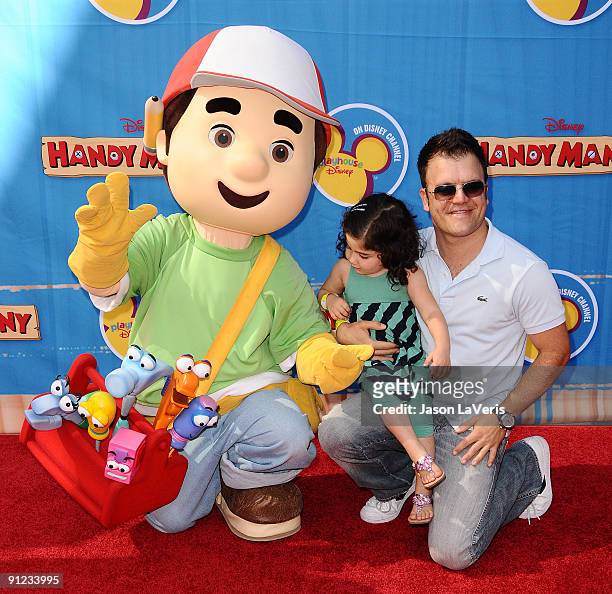 Actor Kevin Weisman and his daughter attend the premiere of "Handy Manny Motorcycle Adventure" at ArcLight Cinemas on September 26, 2009 in...