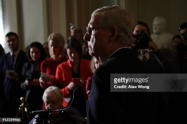 Senate Majority Leader Sen. Mitch McConnell listens during a news briefing after the weekly Senate Republican Policy Luncheon January 30, 2018 at the...