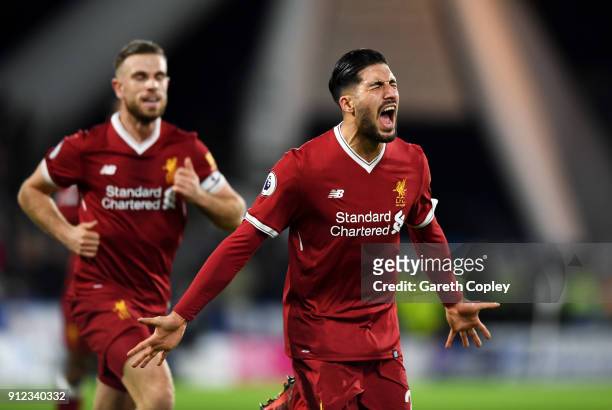 Emre Can of Liverpool celebrates as he scores their first goal with Jordan Henderson during the Premier League match between Huddersfield Town and...