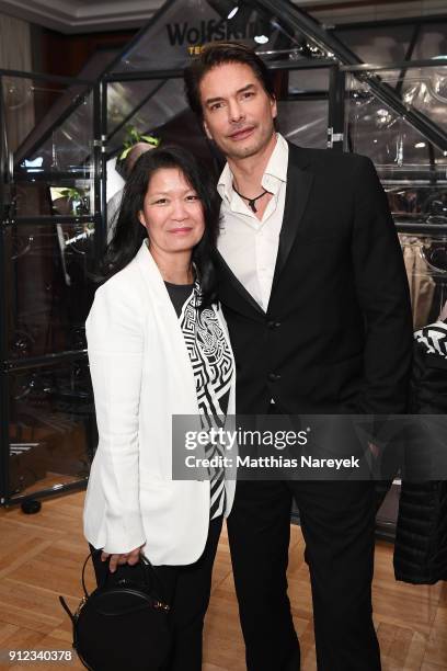 Wolfskin TECH LAB Melody Harris-Jensbach and Marcus Schenkenberg attend the Wolfskin TECH LAB x Gianni Versace retrospective opening event at...