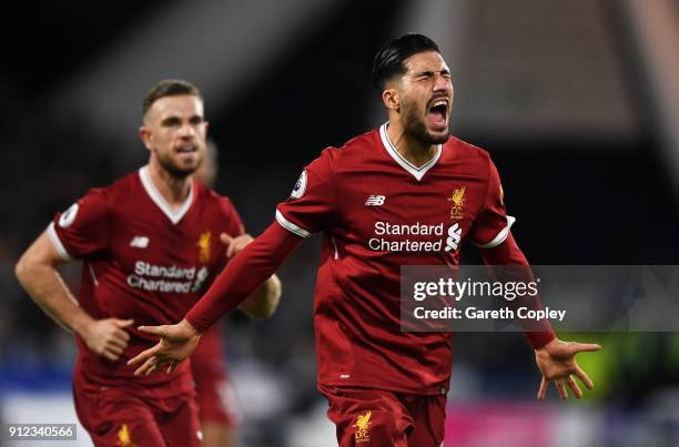 Emre Can of Liverpool celebrates as he scores their first goal with Jordan Henderson during the Premier League match between Huddersfield Town and...