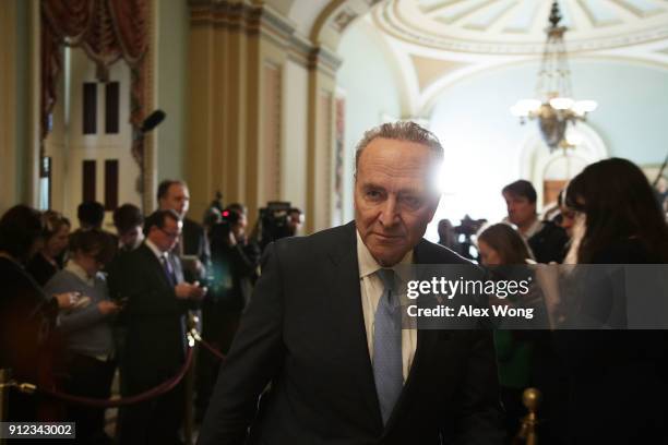 Senate Minority Leader Sen. Chuck Schumer leaves after speaking to members of the media during a news briefing January 30, 2018 at the Capitol in...