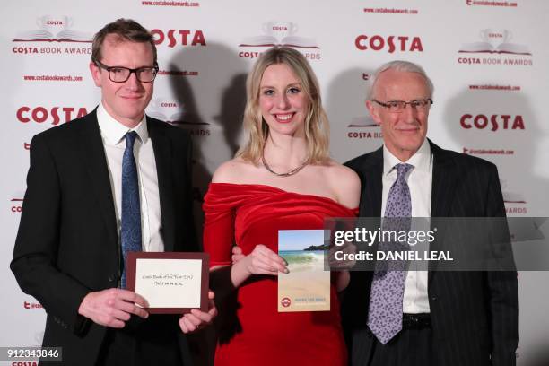Patrick Charnley, Tess Charnley, and Frank Charnley children and husband of the late British poet and author Helen Dunmore pose with Helen's 'Poetry'...