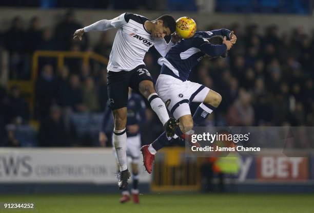 Curtis Davies of Derby County wins a header over Lee Gregory of Millwall during the Sky Bet Championship match between Millwall and Derby County at...