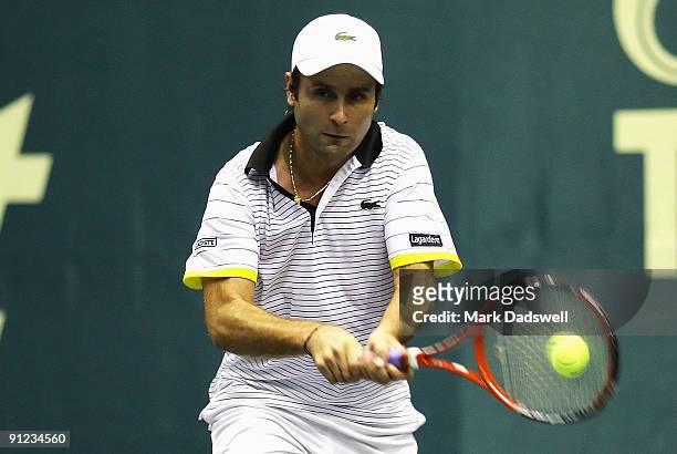 Fabrice Santoro of France hits a backhand in his match against Evgeny Korolev of Russia during day four of the 2009 Thailand Open at Impact Arena on...