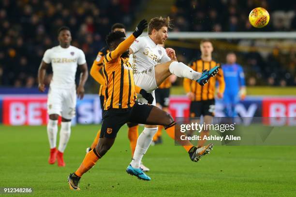 Gaetano Berardi of Leeds United wins the ball from Hull City's Nouha Dicko during the Sky Bet Championship match between Hull City and Leeds United...