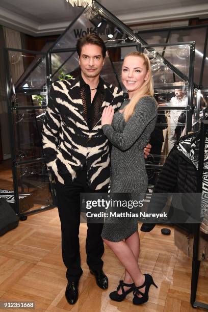 Marcus Schenkenberg and guest attend the Wolfskin TECH LAB x Gianni Versace retrospective opening event at Kronprinzenpalais on January 30, 2018 in...