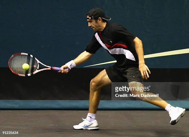 Benjamin Becker of Germany hits a forehand in his match with Marsel Ilhan of Turkey during day four of the 2009 Thailand Open at Impact Arena on...