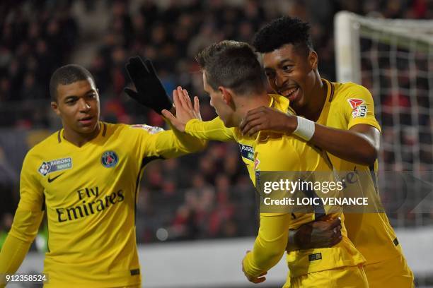 Paris Saint-Germain's Argentinian midfielder Paris Saint-Germain's Argentinian midfielder Giovanni Lo Celso celebrates with teammates after scoring a...