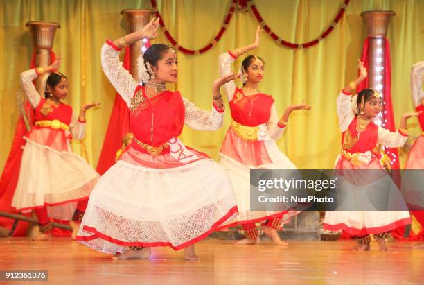 Tamil Bharatnatyam dancers perform a fusion dance mixing traditional styles with modern elements during a cultural program celebrating Tamil Heritage...