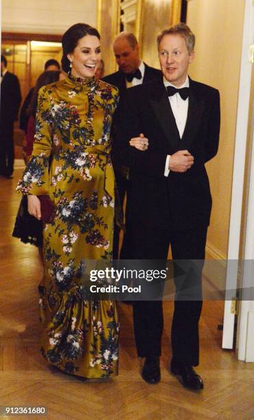 Catherine, Duchess of Cambridge is escorted by the British Ambassador to Sweden David Cairns at a reception dinner at the British Ambassador's...