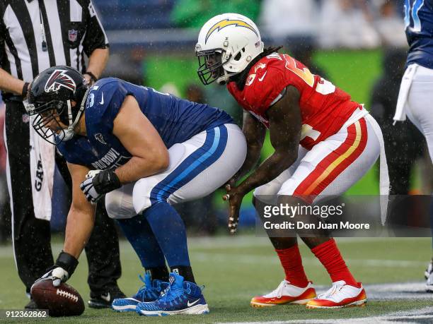 Center Alex Mack of the Atlanta Falcons from the NFC Team hikes the ball to Defensive End Melvin Ingram of the Los Angeles Chargers from the AFC Team...