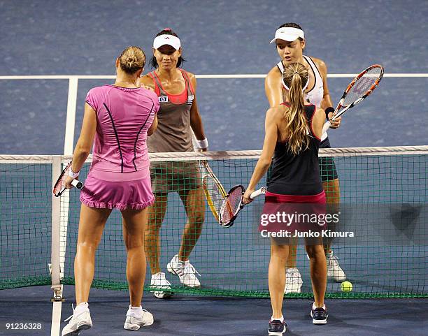 Gisela Dulko of Argentina and Nadia Petrova of Russia as well as Yung-Jan Chan of Chinese Taipei and Kimiko Date Krumm of Japan greet each other...