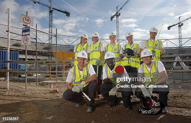 Samantha Scowen, Kate Walsh, Sam Hynd, Mary King, Ahmed Rosowsky Anthony Clark, Darius Knight and Liam Phillips pose inside the London 2012 Stadium...