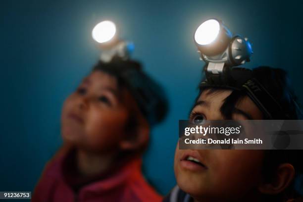 children with head torches - head torch stock pictures, royalty-free photos & images