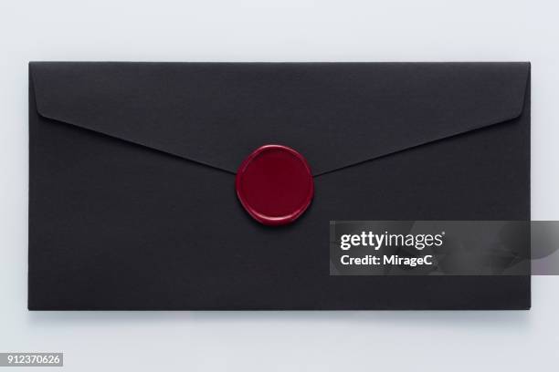 black envelope sealed with wax stamp - envelope stock pictures, royalty-free photos & images