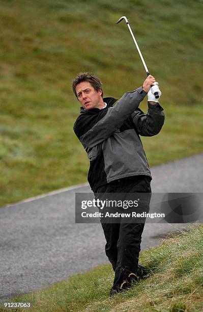 Film star Hugh Grant in action during the second practice round of The Alfred Dunhill Links Championship at Kingsbarns Golf Links on September 29,...