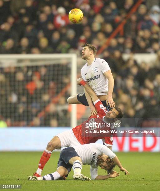 Preston North End's Paul Huntington and Ben Pearson battles with Nottingham Forest's Tendayi Darikwa during the Sky Bet Championship match between...