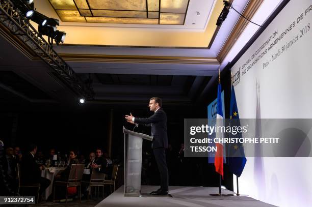 French President Emmanuel Macron delivers a speech during the annual dinner of CCAF in Paris on January 30, 2018.