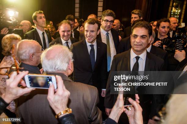 French president Emmanuel Macron and CCAF co-Presidents Ara Toranian and Murat Papazian arrive at the annual dinner of CCAF in Paris on January 30,...