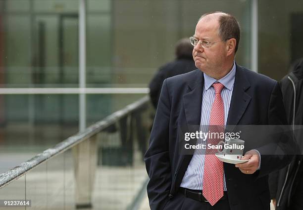 German Finance Minister and member of the German Social Democrats Peer Steinbrueck takes a break with a cup of coffee during the first meeting of the...